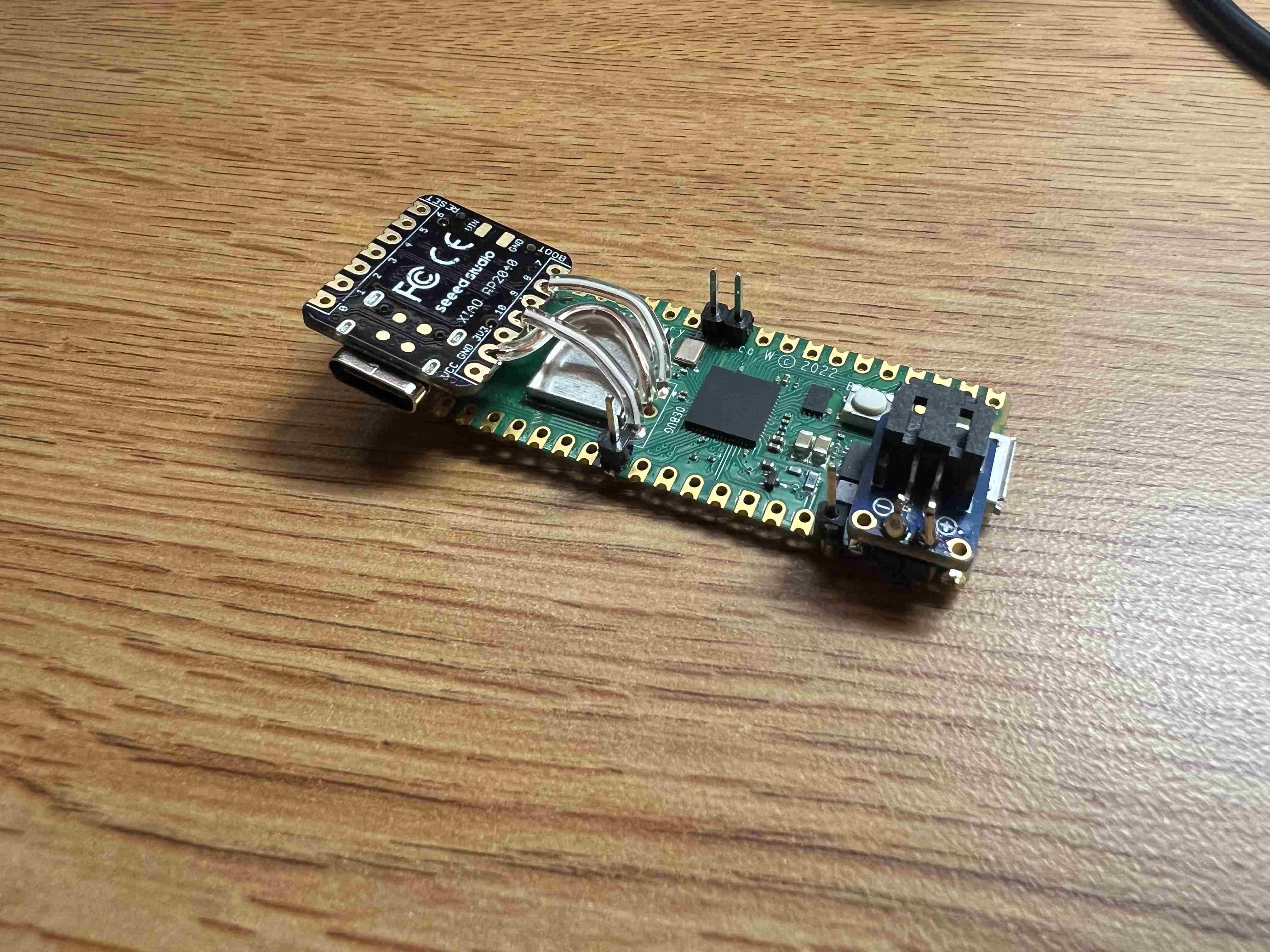 A XIAO soldered to the debug port on a Raspberry Pi Pico W